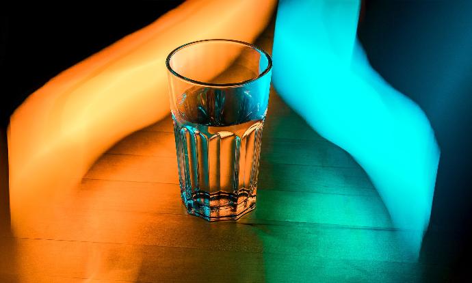 Glass of water with neon lights