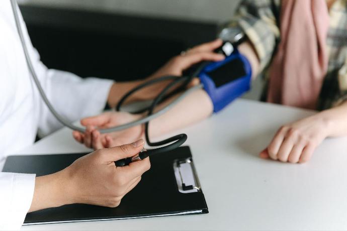 Doctor taking digital blood pressure