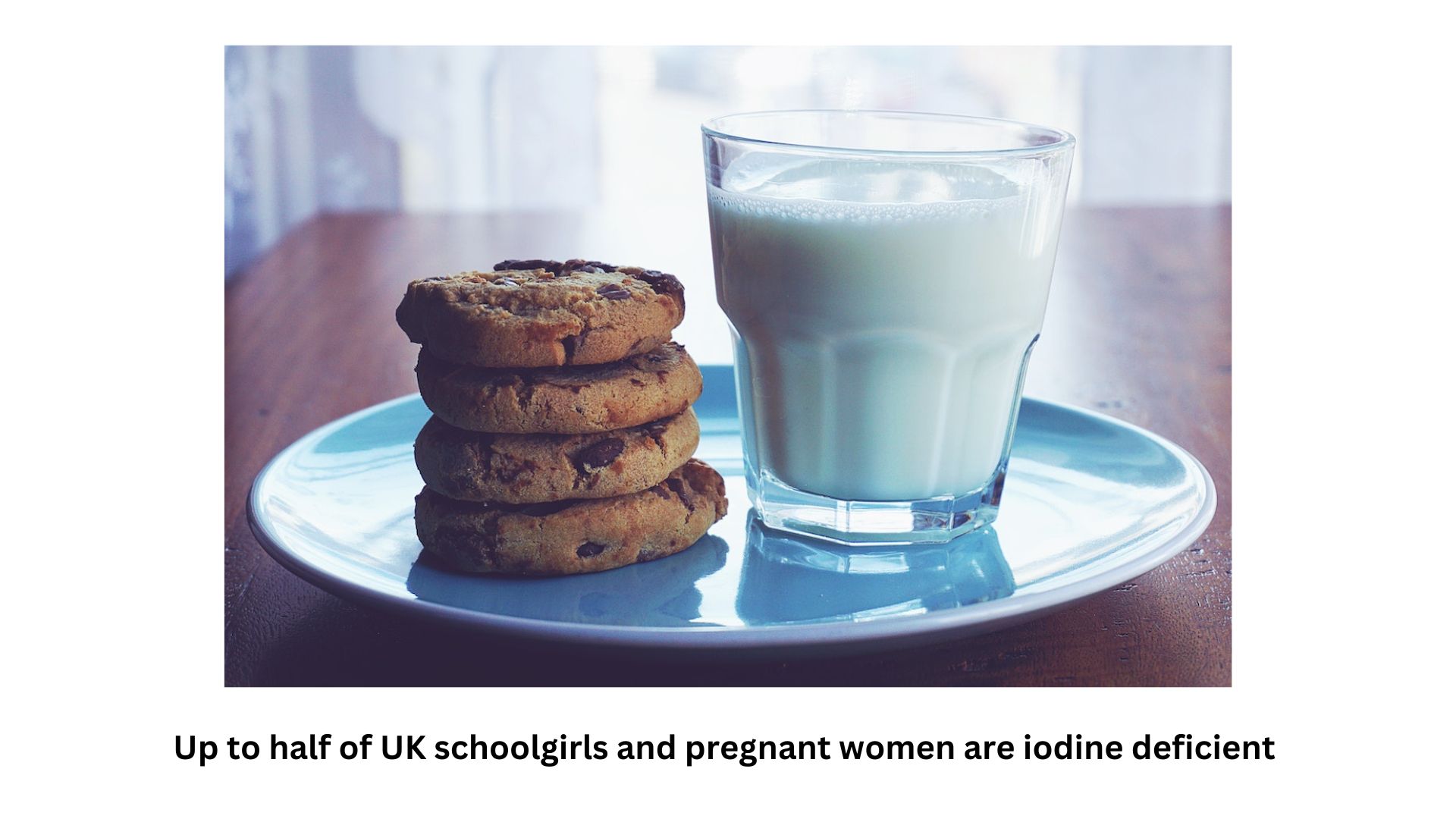 Cookies and a glass of milk on top of a table