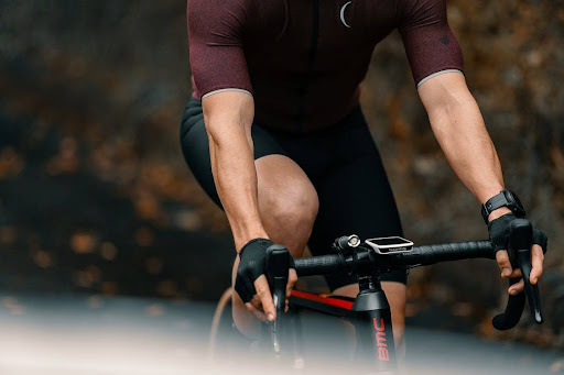 A cyclist in red suit